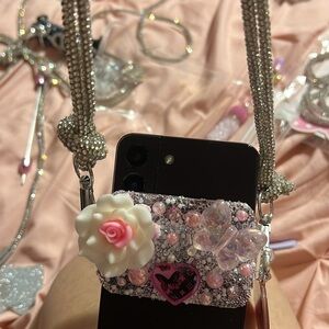 Pink Phone Strap with Charm and Matching Pen. Comes with Rhinestone strap.